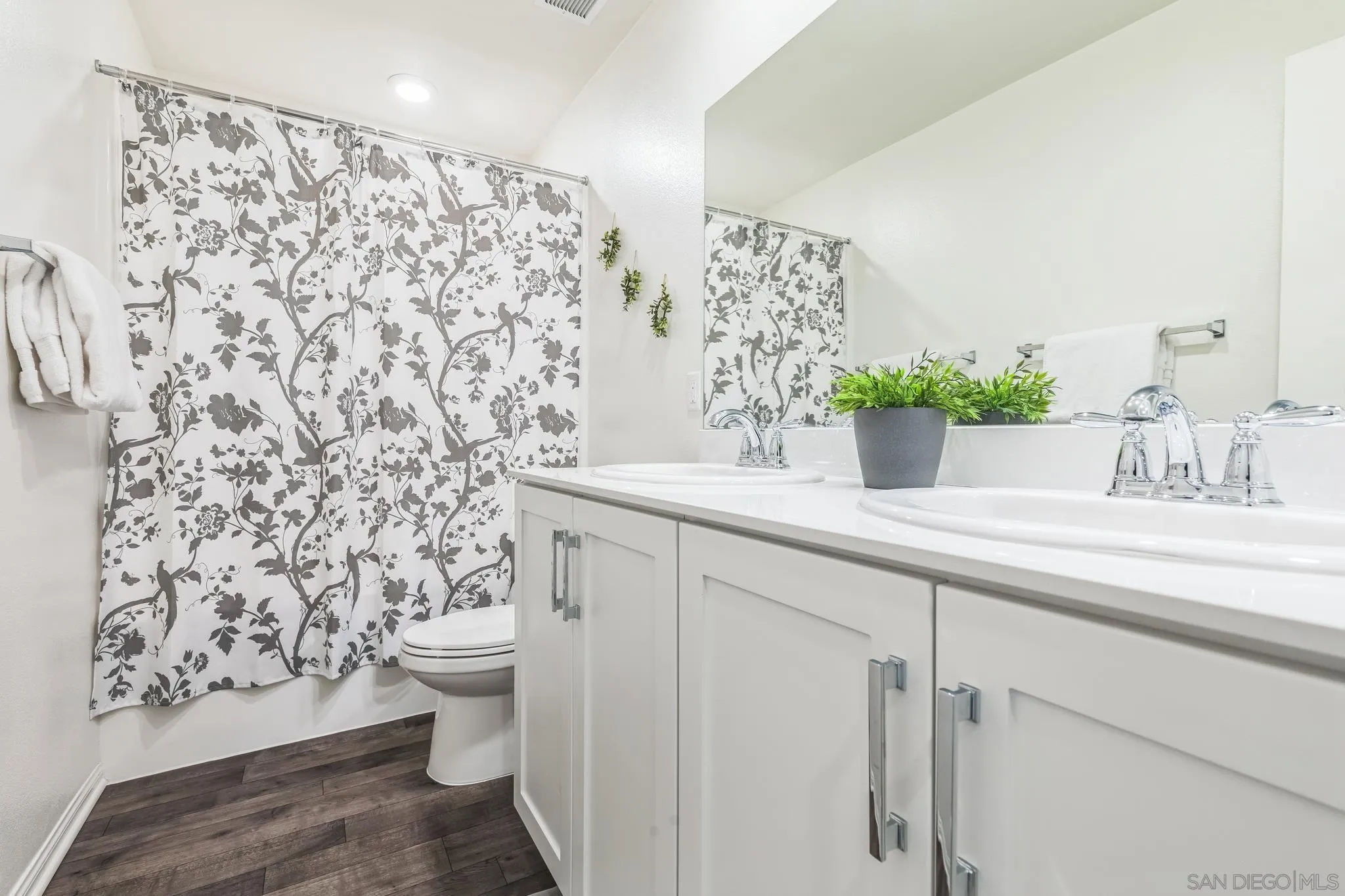 5522 Starlight Place Bonsall, CA 92003 - Photo 22 of 32 a bathroom with a sink toilet and shower