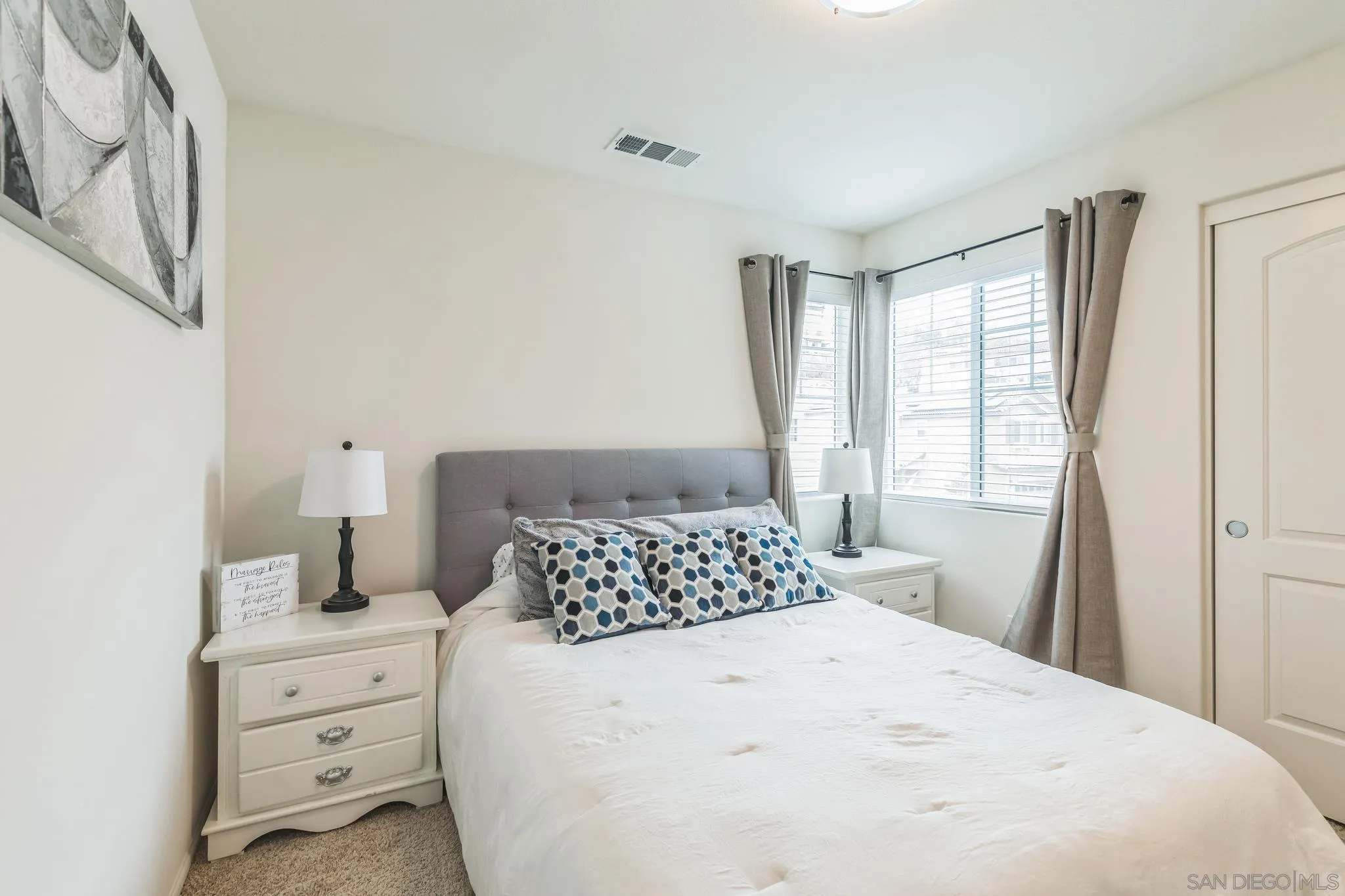 5522 Starlight Place Bonsall, CA 92003 - Photo 23 of 32 a bedroom with a bed and a window