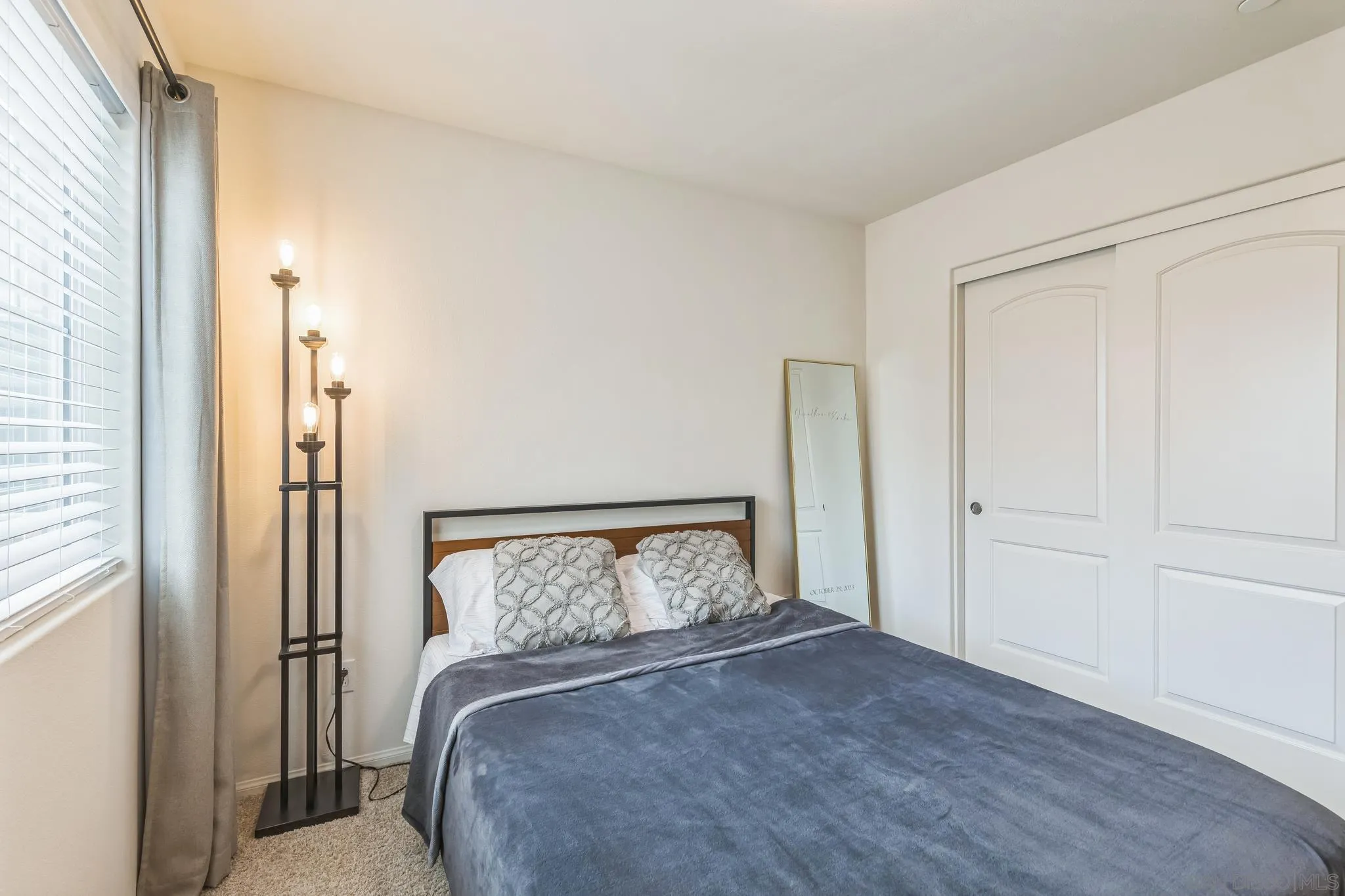 5522 Starlight Place Bonsall, CA 92003 - Photo 25 of 32 a bedroom with a bed and a window