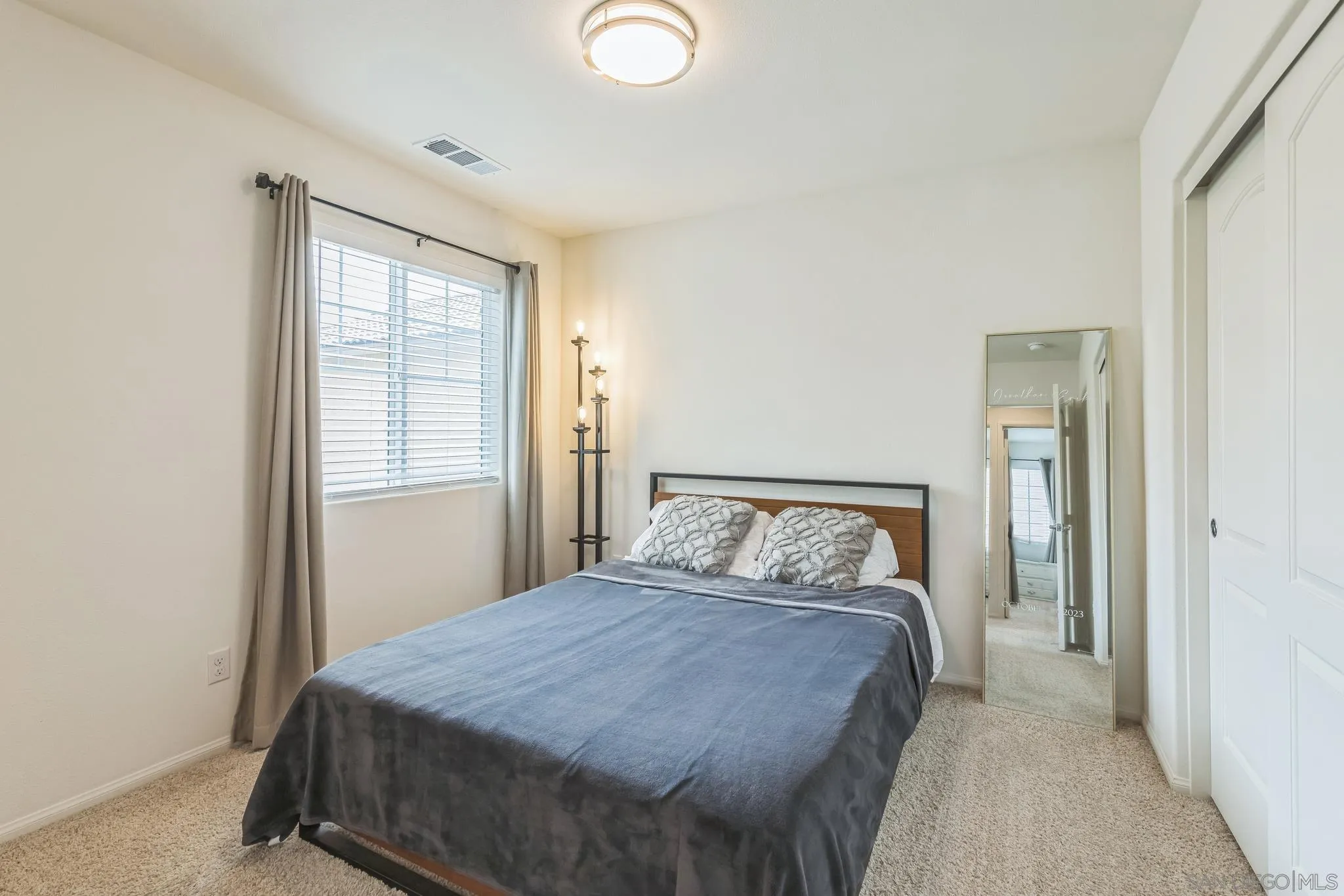 5522 Starlight Place Bonsall, CA 92003 - Photo 26 of 32 a bedroom with a bed and a window