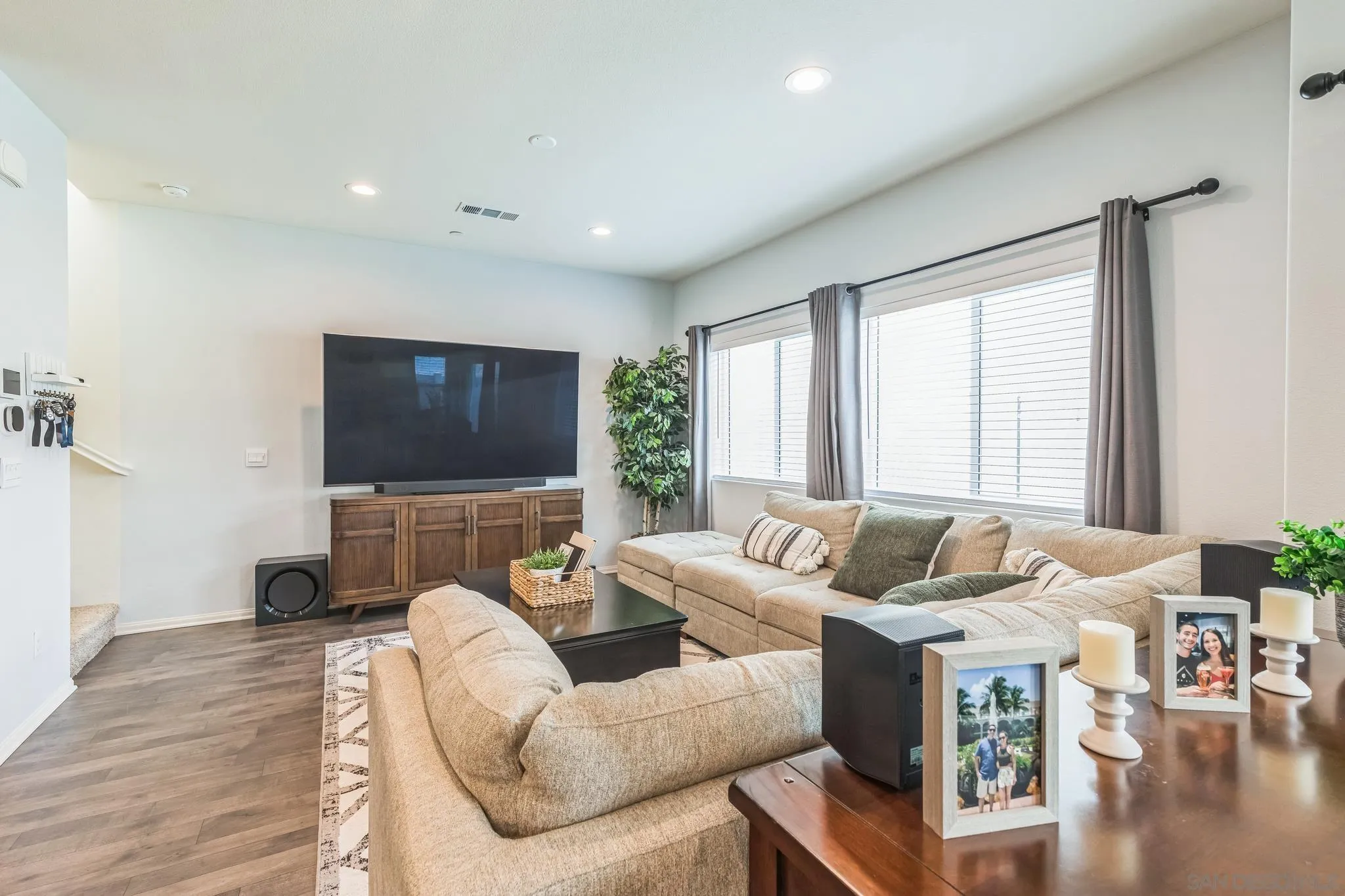 5522 Starlight Place Bonsall, CA 92003 - Photo 6 of 32 a living room with furniture and a flat screen tv