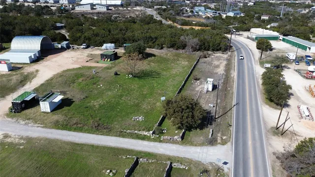 an aerial view of a house with yard