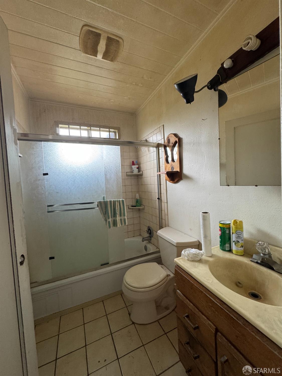 1175 Rachel Road San Pablo, CA 94806 - Photo 3 of 4 a bathroom with a granite countertop sink a toilet and shower