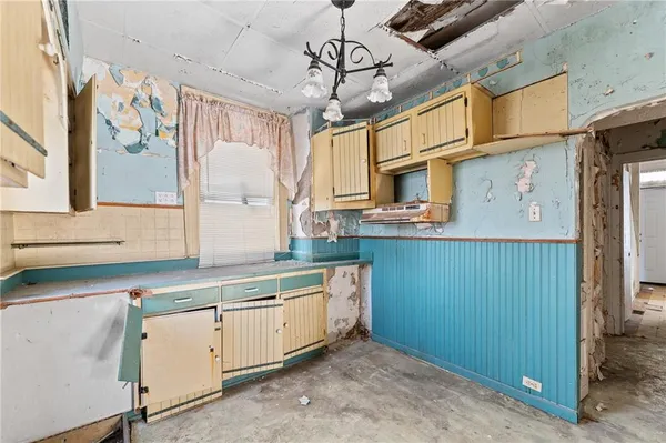 a kitchen with cabinets a sink and dishwasher