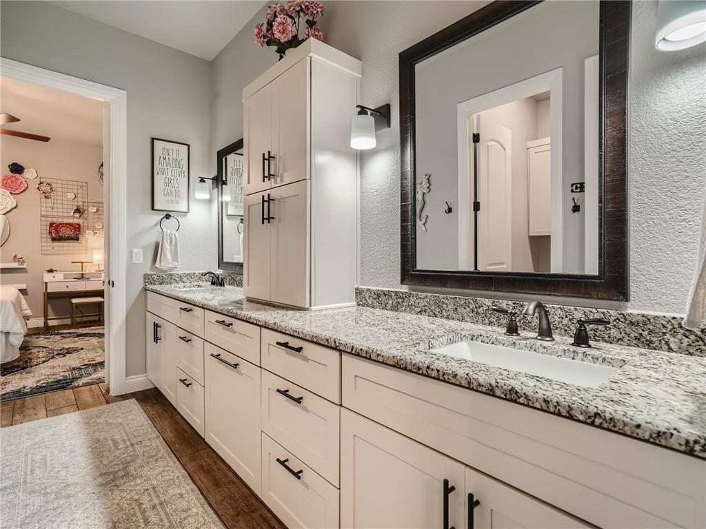 132 Huerta Road Florence, TX 76527 - Photo 21 of 40 Granite counters and dual sinks provide ample space in this well-appointed bathroom.