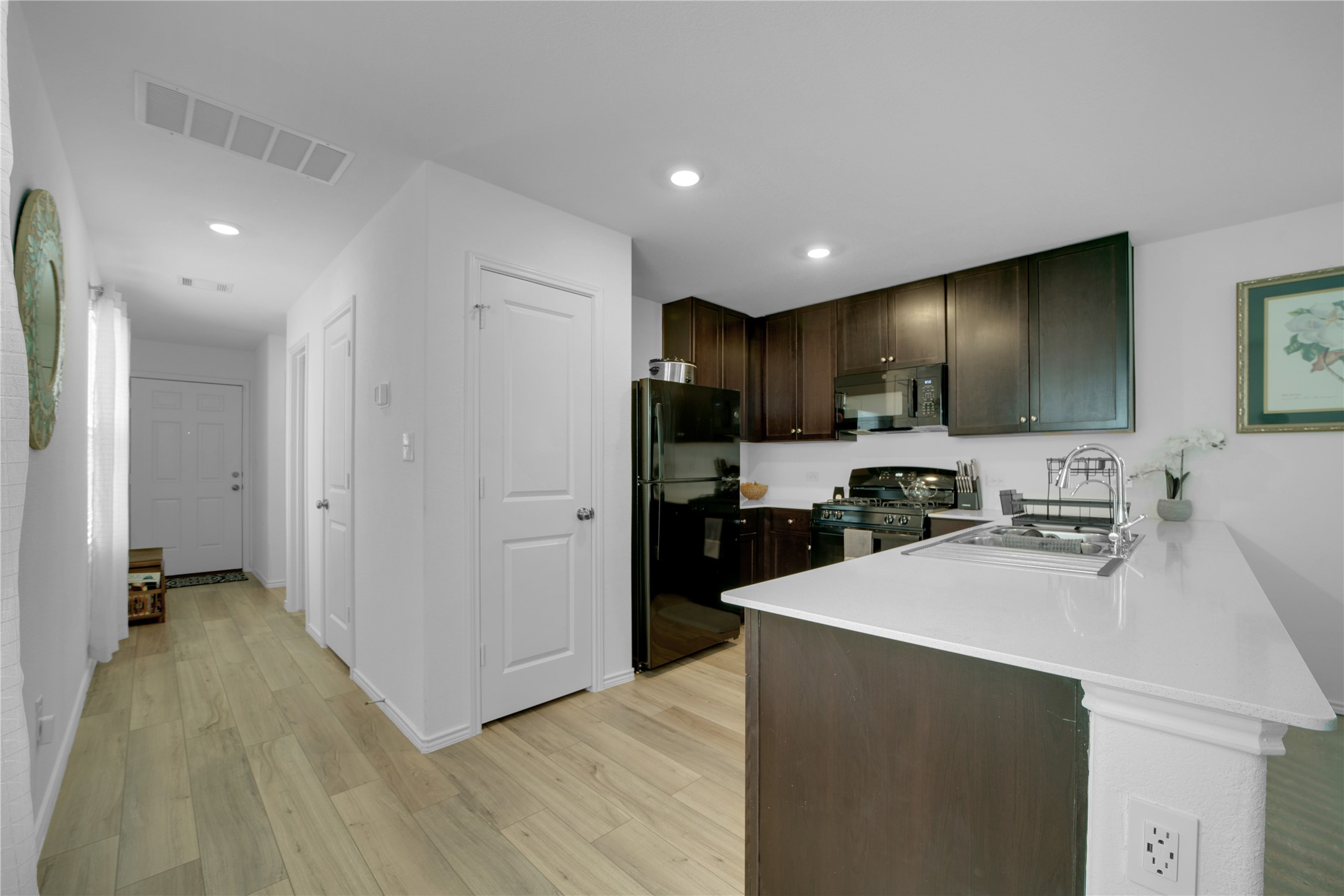 36 Trinity Circle Lockhart, TX 78644 - Photo 12 of 36 a kitchen with sink cabinets and stainless steel appliances