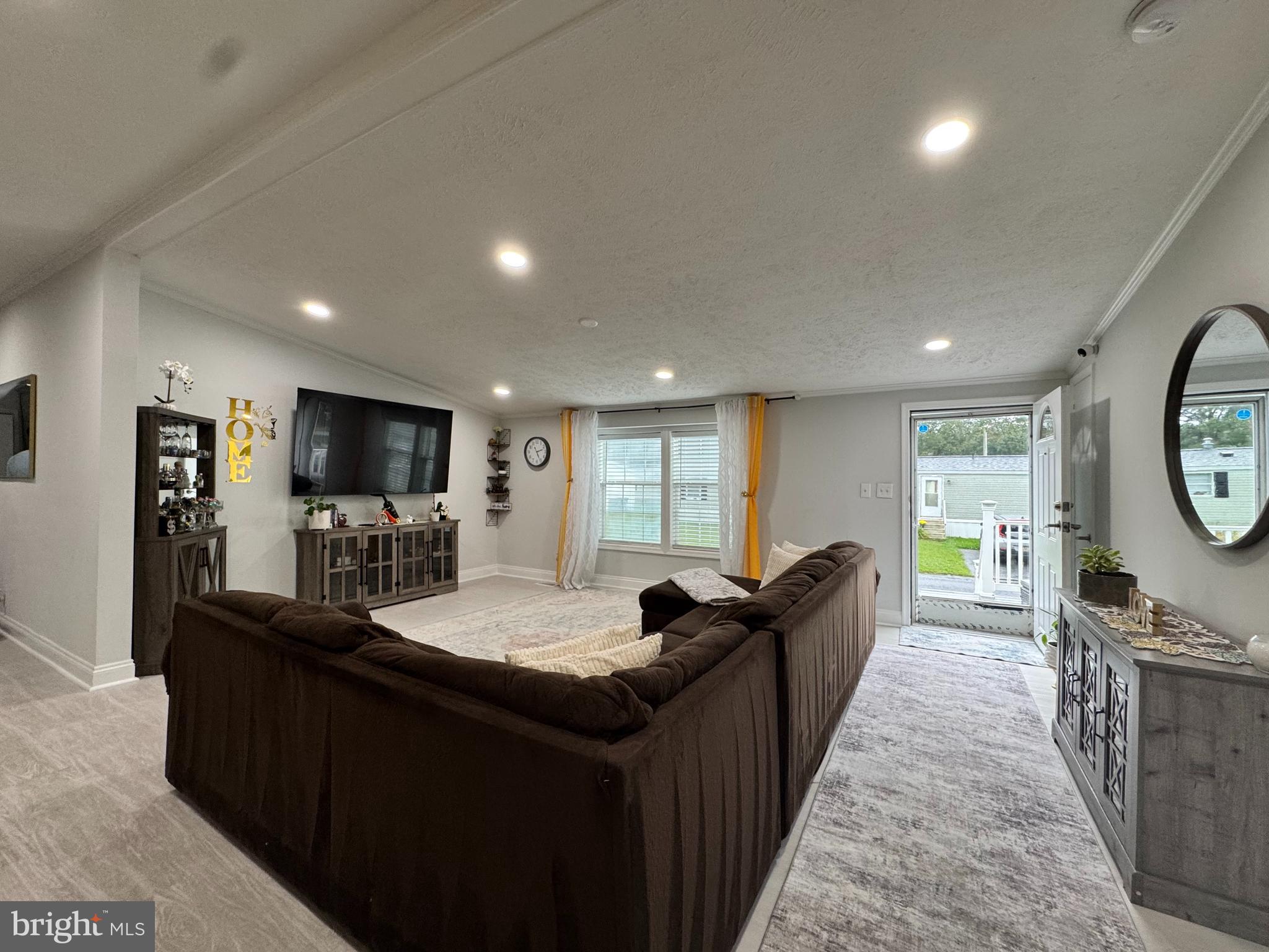 5 Emery Circle Delmar, DE 19940 - Photo 20 of 49 a living room with stainless steel appliances kitchen island granite countertop a sink a counter top space and a window