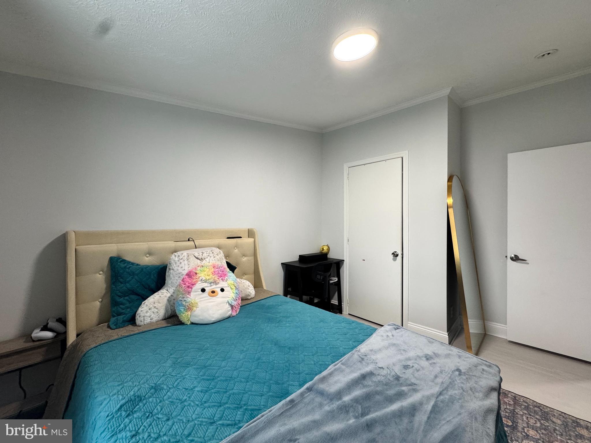 5 Emery Circle Delmar, DE 19940 - Photo 38 of 49 a bedroom with a bed and wooden floor