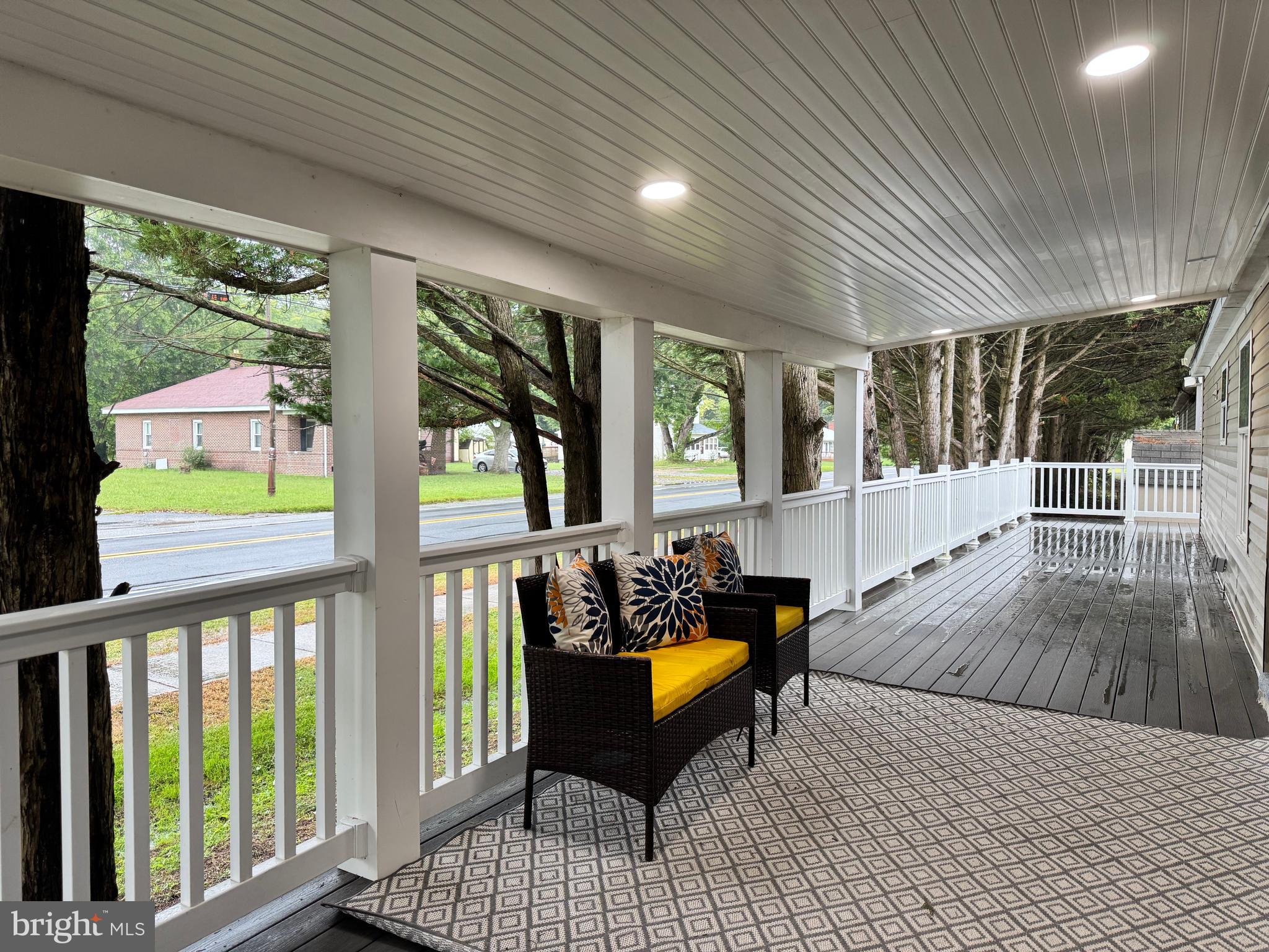 5 Emery Circle Delmar, DE 19940 - Photo 45 of 49 a living room with large windows and wooden floor