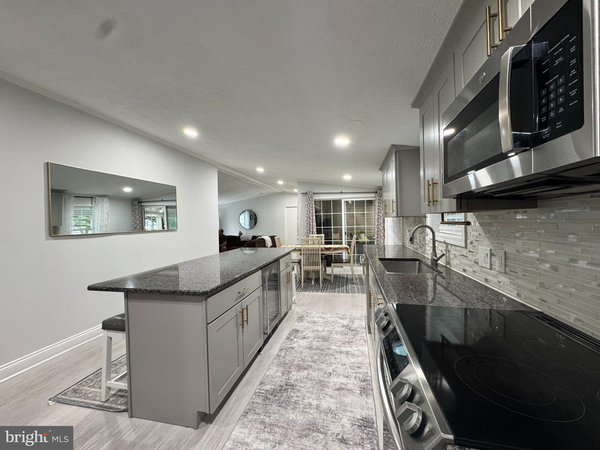 5 Emery Circle Delmar, DE 19940 - Photo 8 of 49 a large kitchen with stainless steel appliances granite countertop a sink and a stove