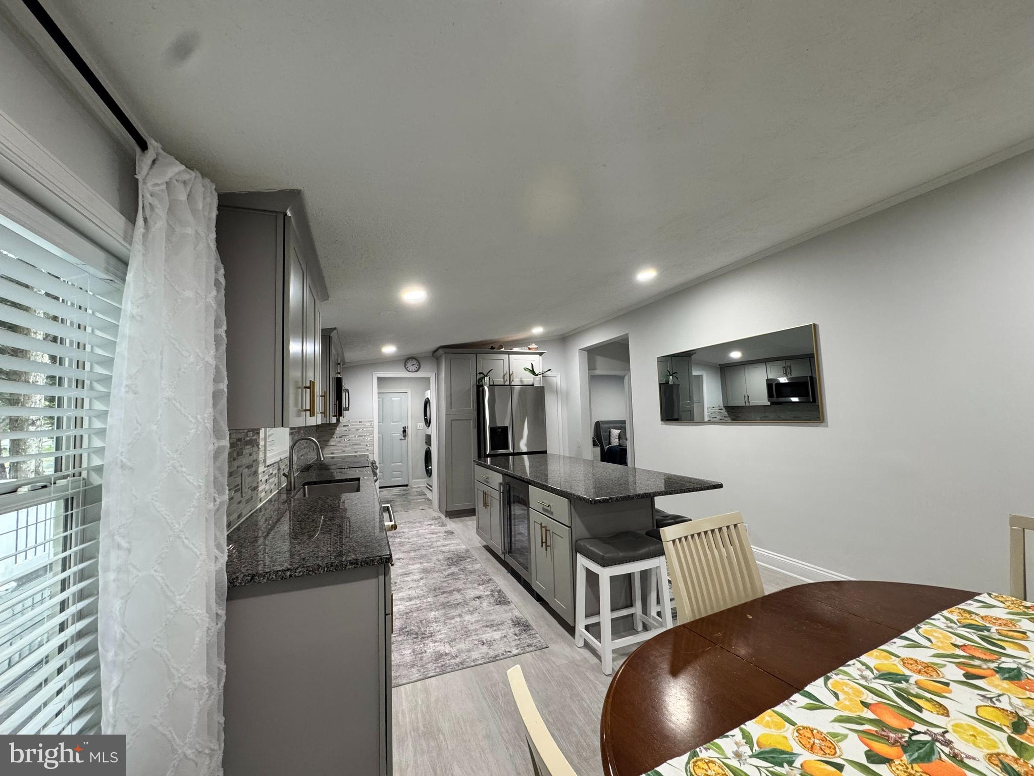 5 Emery Circle Delmar, DE 19940 - Photo 9 of 49 a kitchen with stainless steel appliances kitchen island granite countertop a sink and cabinets
