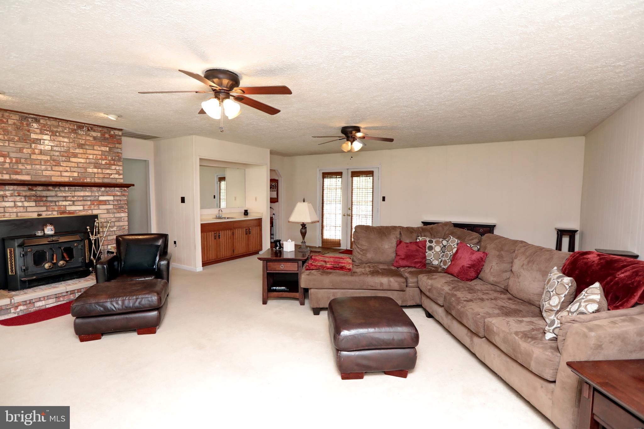 8865 Lowell Road Pomfret, MD 20675 - Photo 28 of 46 Family Room with fireplace & wet bar
