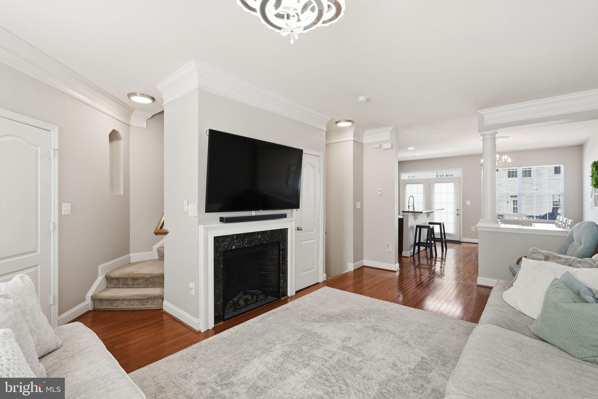 5027 Potomac Highlands Circle Triangle, VA 22172 - Photo 12 of 32 Living room with view into kitchen and dining area