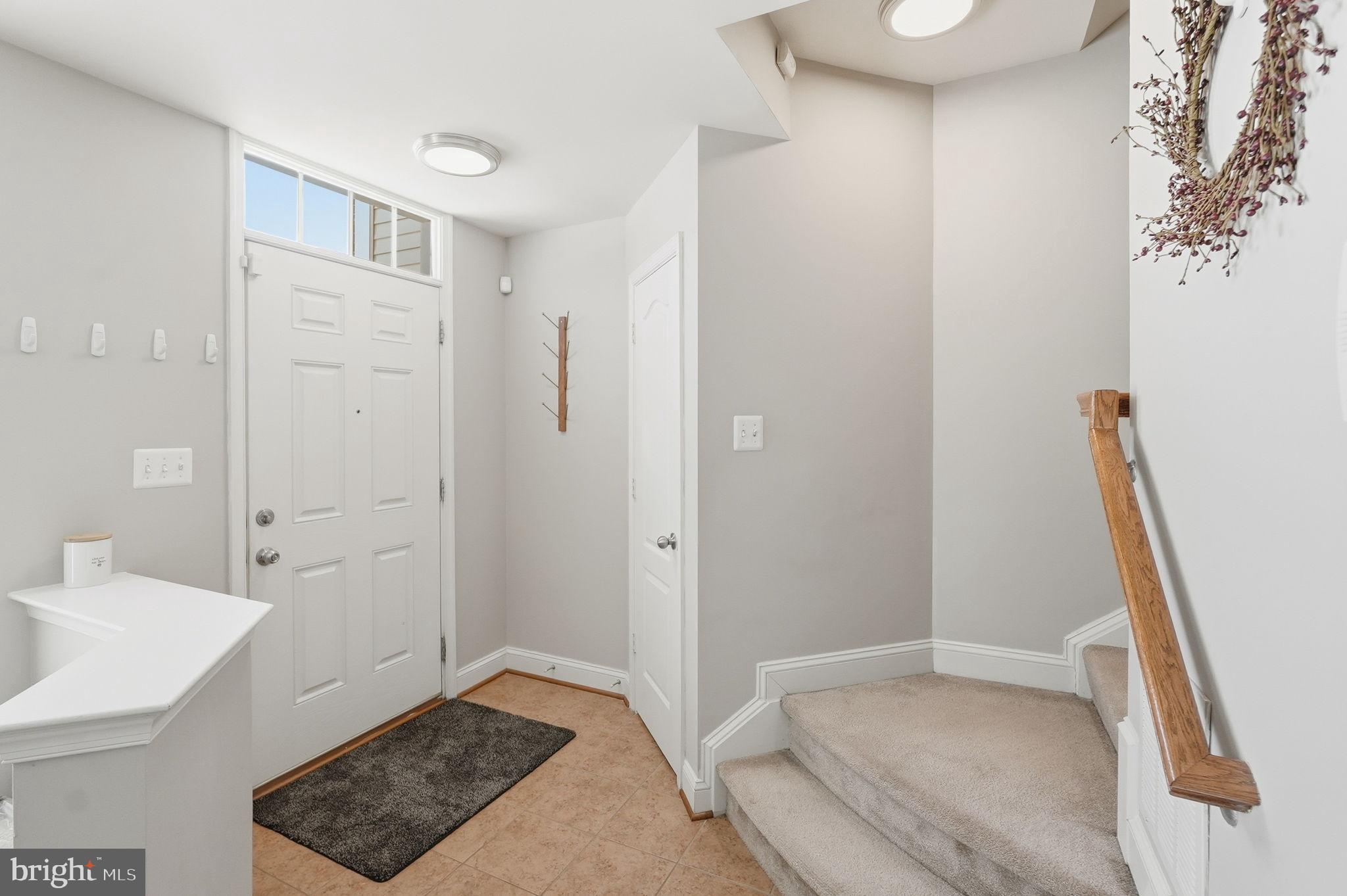 5027 Potomac Highlands Circle Triangle, VA 22172 - Photo 2 of 32 Welcoming entryway with natural light.