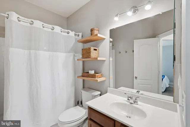 a view of a chairs and table on the wooden deck