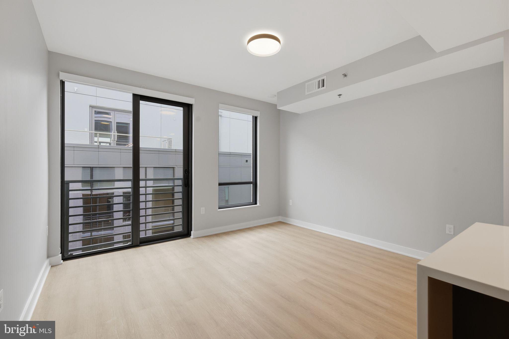 950 3rd Street Northwest, Unit 907 Washington, DC 20001 - Photo 26 of 34 an empty room with windows