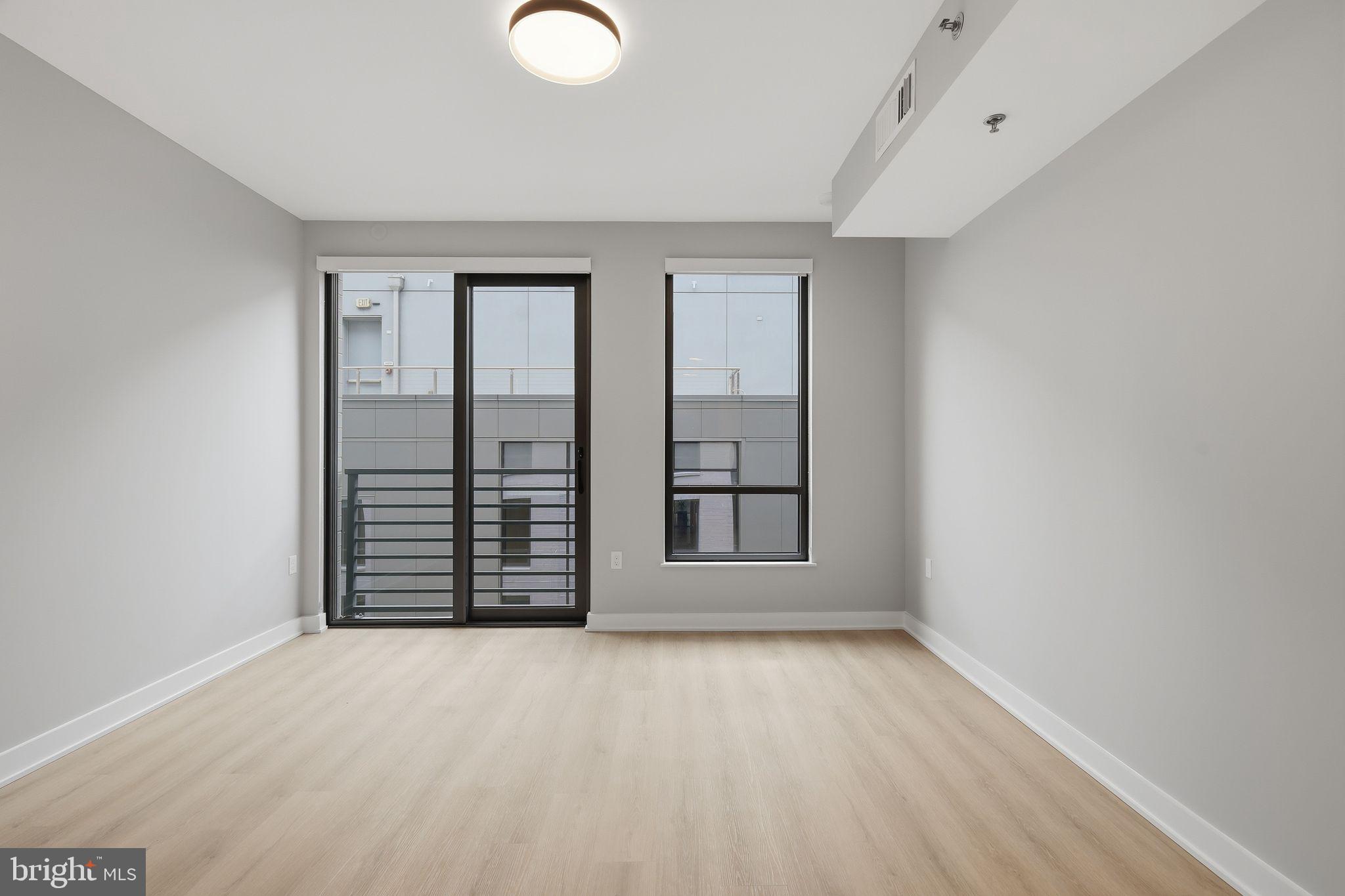 950 3rd Street Northwest, Unit 907 Washington, DC 20001 - Photo 28 of 34 an empty room with windows
