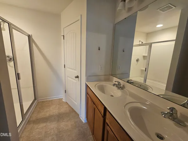 a bathroom with a sink a mirror and a bathtub