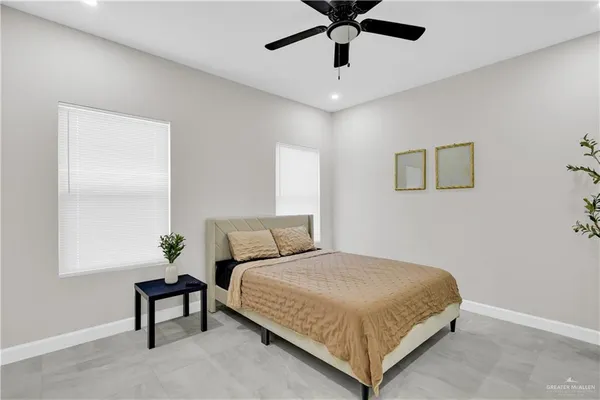 a bedroom with a bed and window