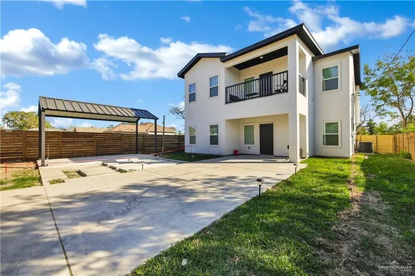 a house view with a backyard space