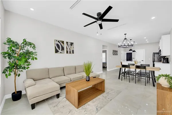 a living room with furniture and a large window