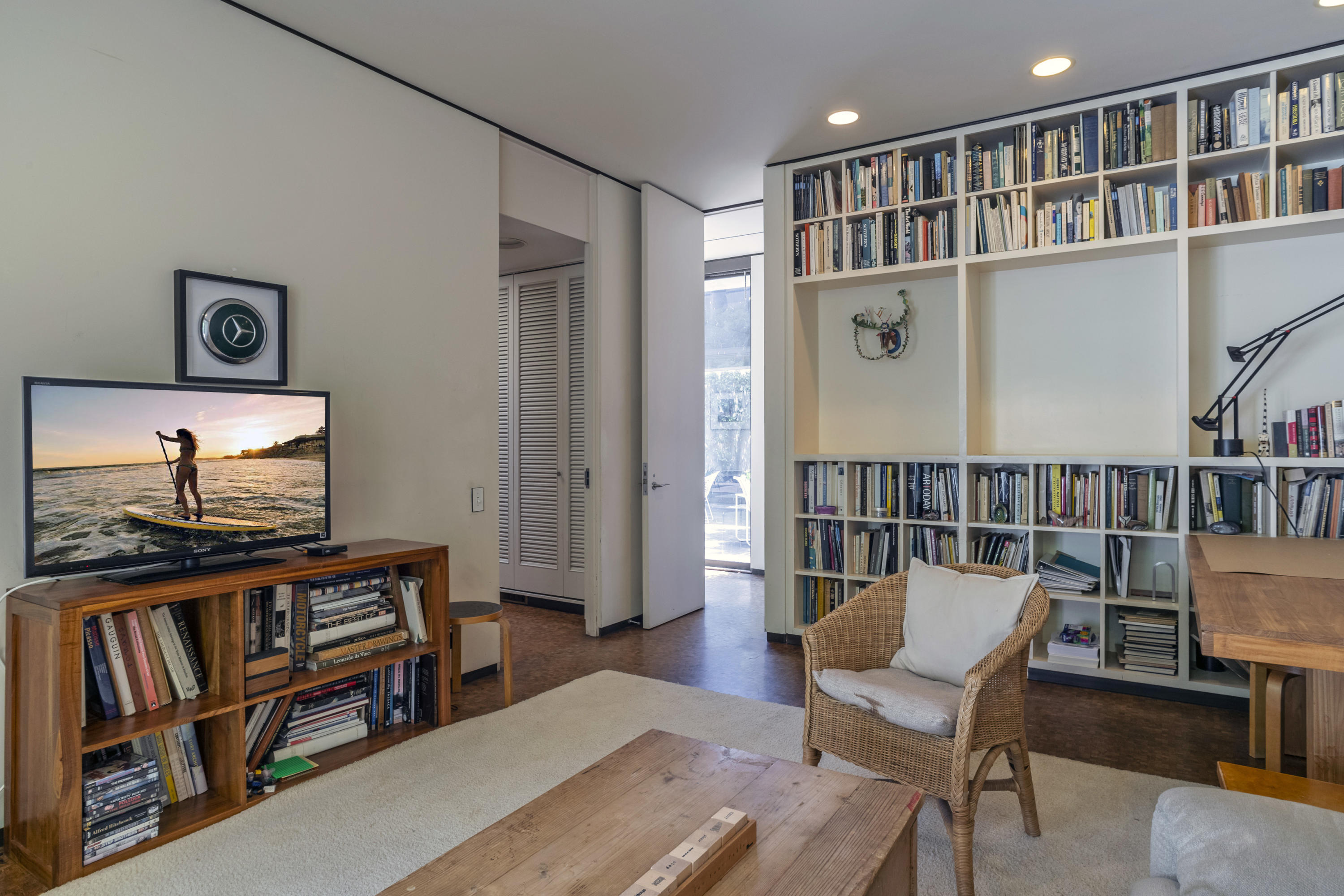 Undisclosed Address Montecito, CA 93108 - Photo 21 of 32 a living room with furniture and a book shelf