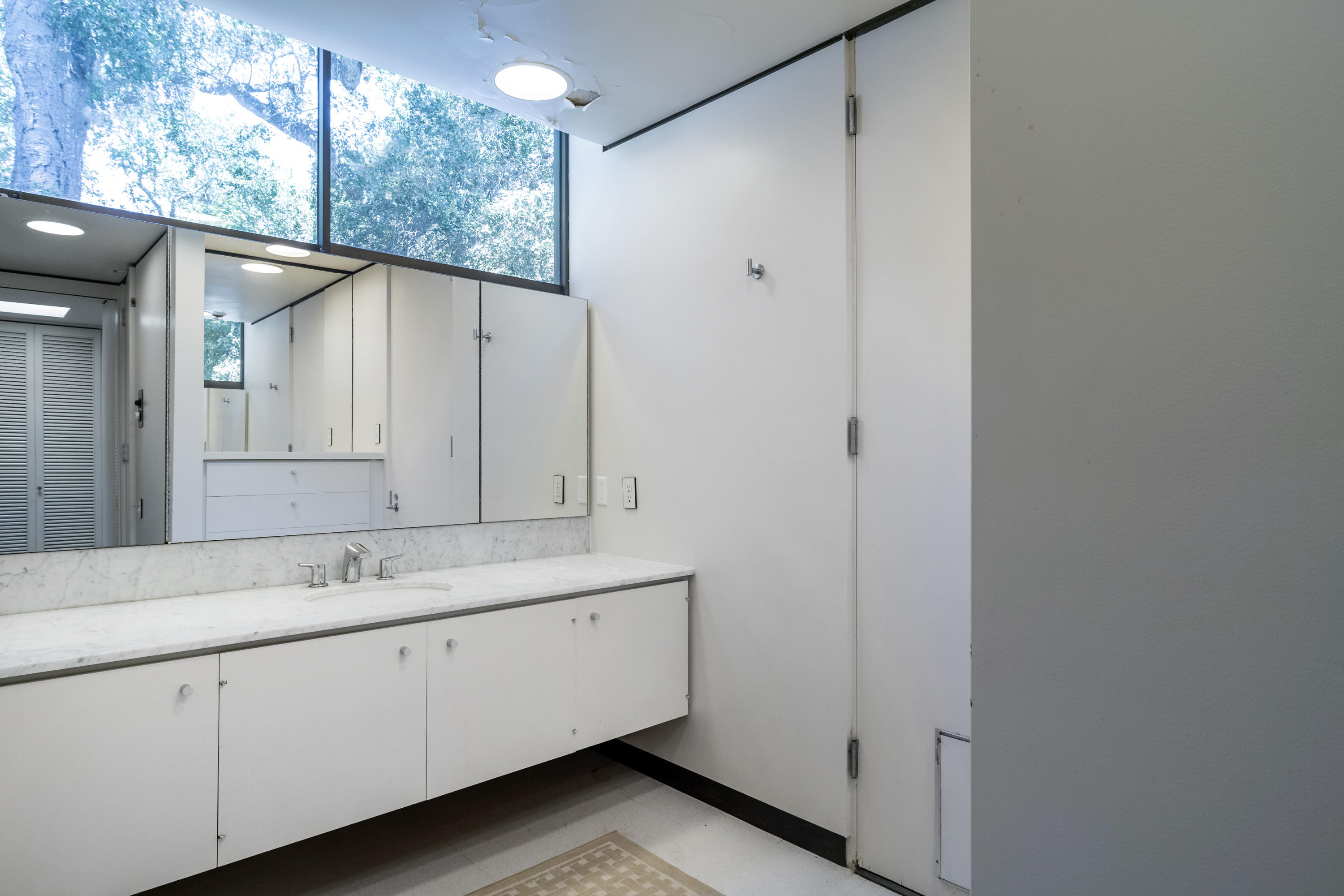 Undisclosed Address Montecito, CA 93108 - Photo 24 of 32 a bathroom with a double vanity sink and mirror