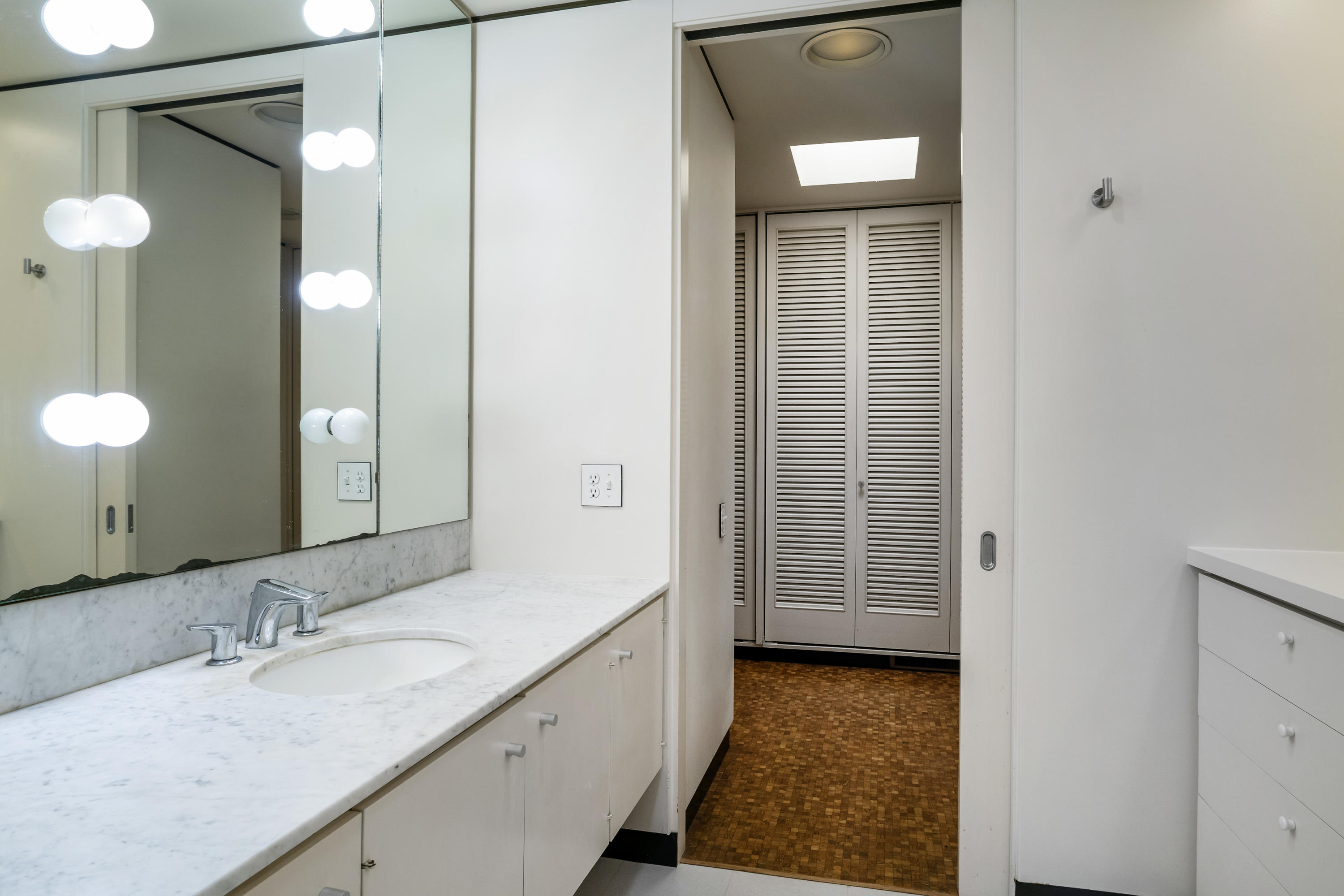 Undisclosed Address Montecito, CA 93108 - Photo 26 of 32 a bathroom with a granite countertop sink and a mirror