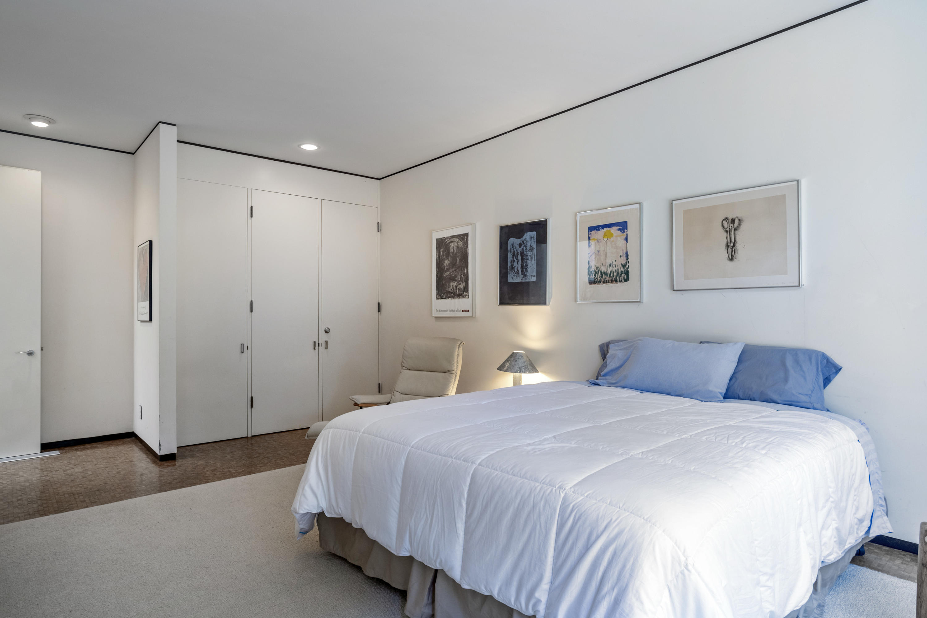 Undisclosed Address Montecito, CA 93108 - Photo 28 of 32 a bedroom with a large bed and a painting on the wall