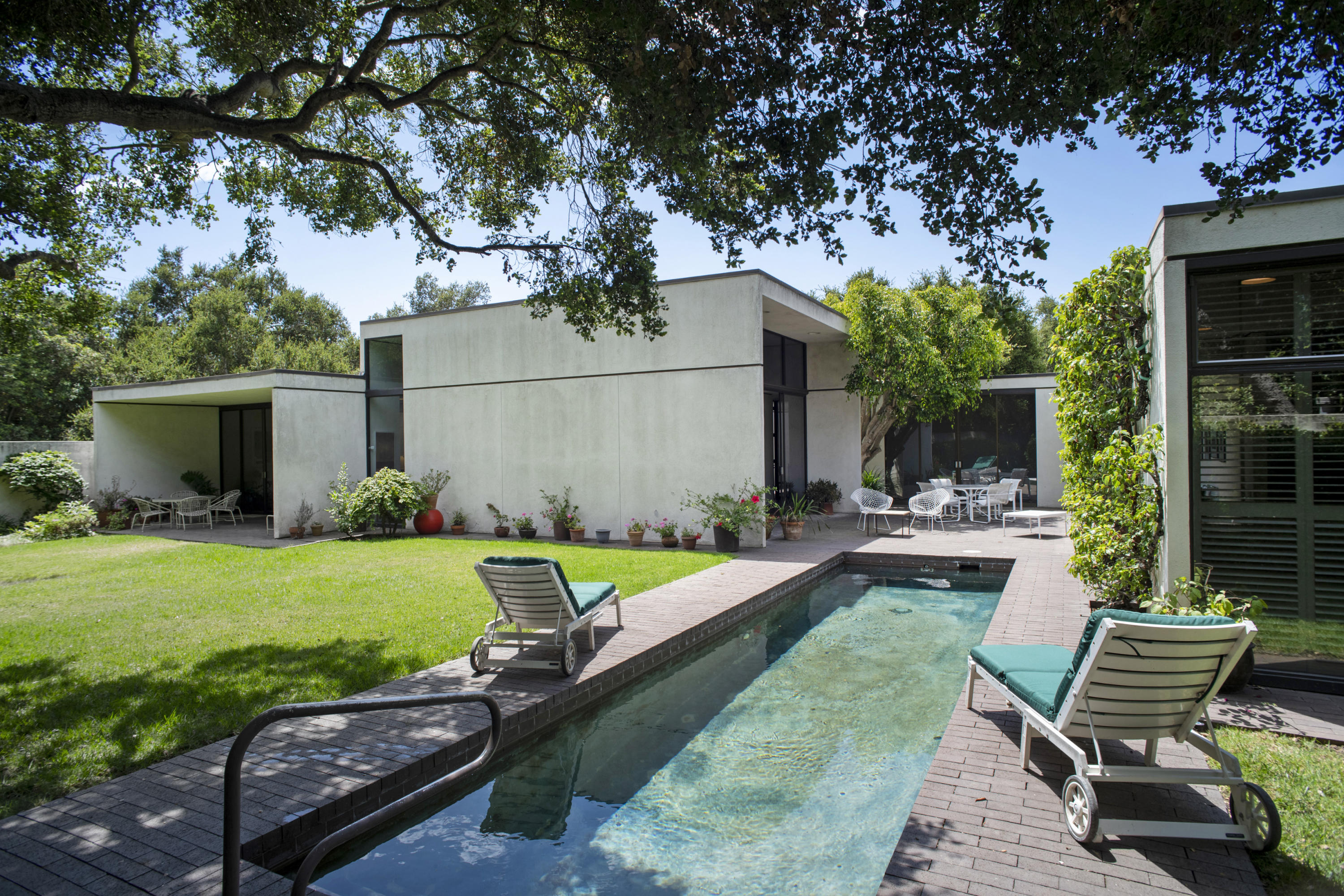 Undisclosed Address Montecito, CA 93108 - Photo 8 of 32 a view of a house with backyard sitting area and garden
