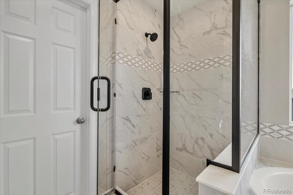 8178 Mount Harvard Road Littleton, CO 80125 - Photo 27 of 39 a bathroom with a shower