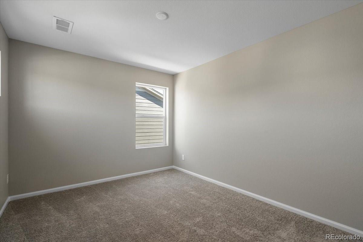 8178 Mount Harvard Road Littleton, CO 80125 - Photo 31 of 39 an empty room with a window