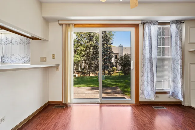 a view of a room that has a large window
