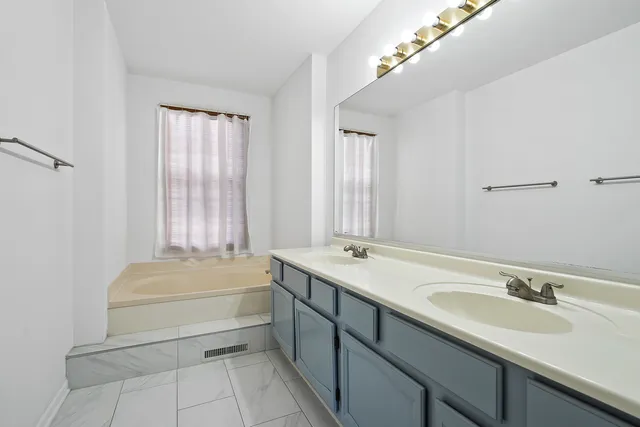 a bathroom with a sink and a bathtub
