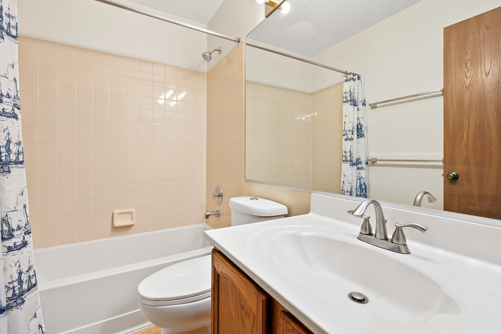 1404 West Sapphire Drive Hoffman Estates, IL 60192 - Photo 21 of 29 a bathroom with a sink toilet vanity and shower