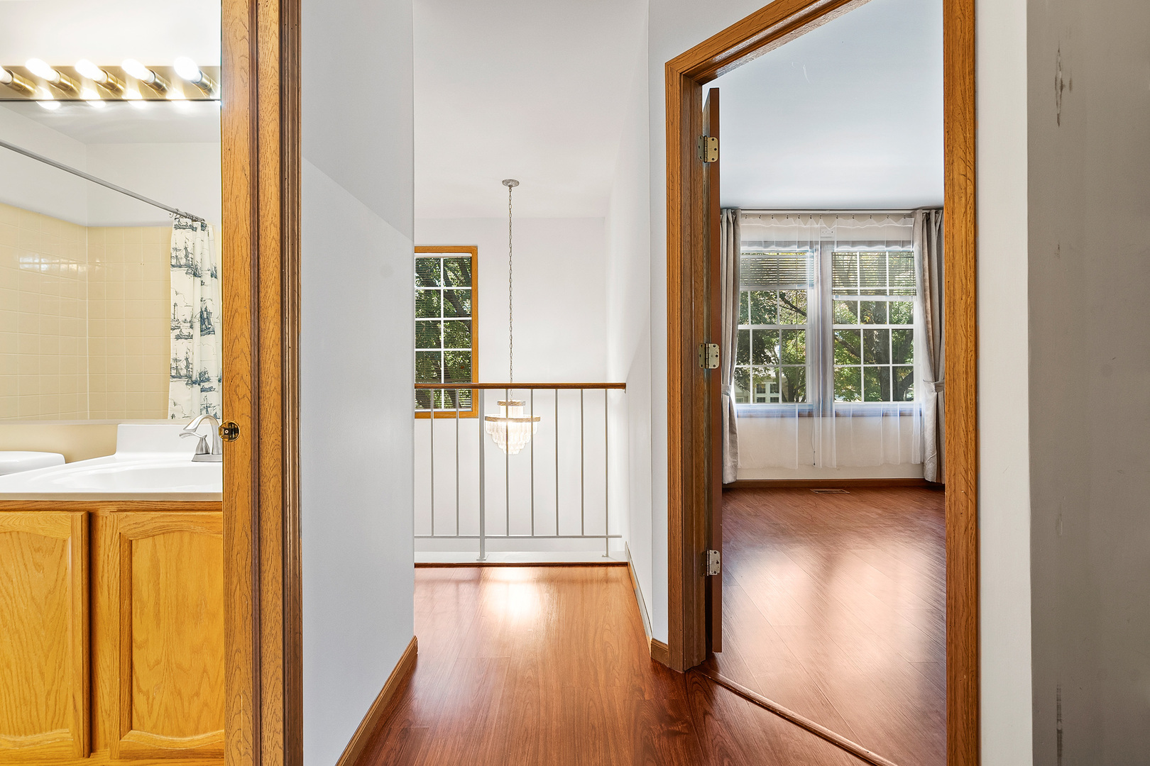 1404 West Sapphire Drive Hoffman Estates, IL 60192 - Photo 22 of 29 a view of a hallway with wooden floor and staircase