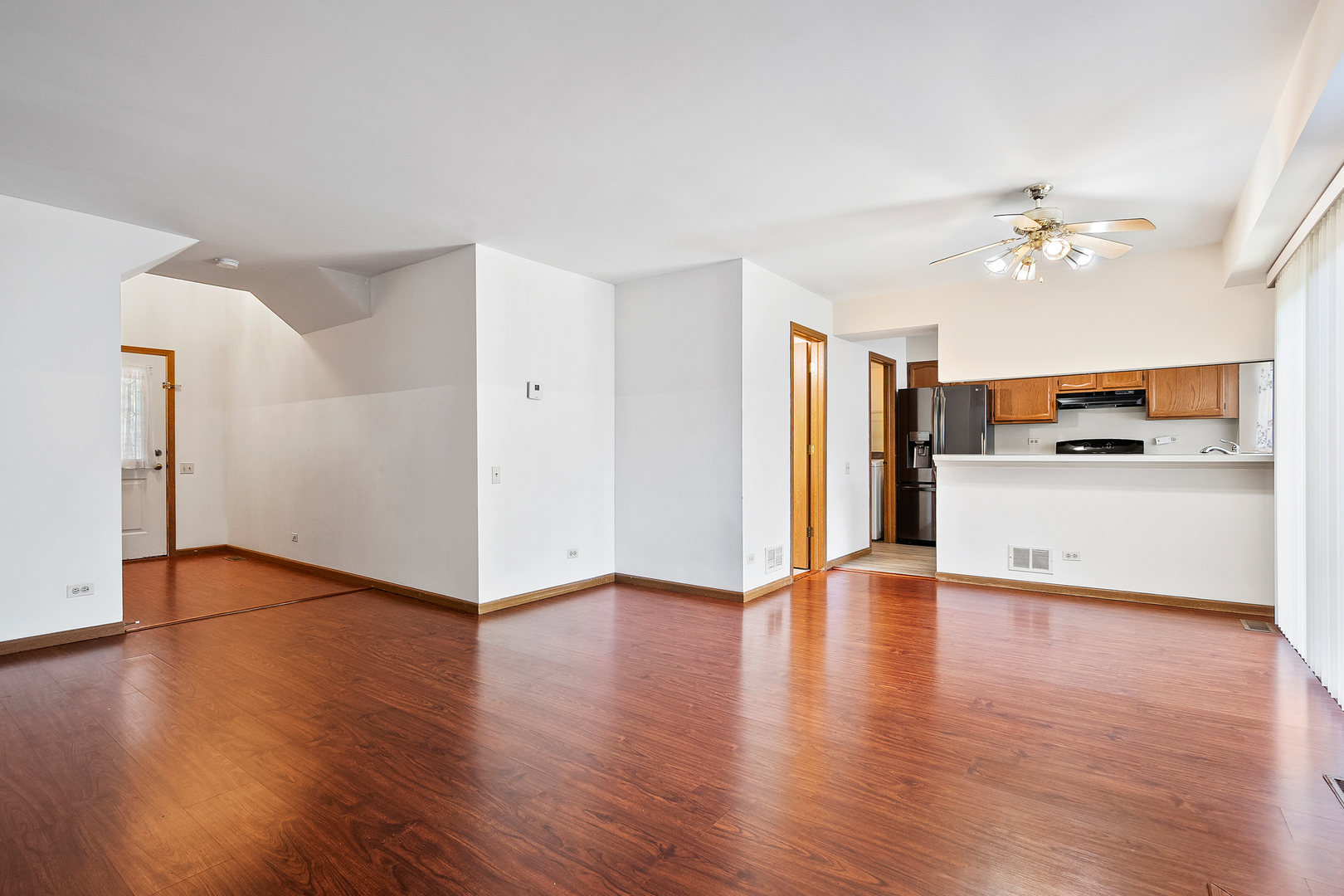 1404 West Sapphire Drive Hoffman Estates, IL 60192 - Photo 6 of 29 a view of a kitchen with a refrigerator a microwave and a stove top oven