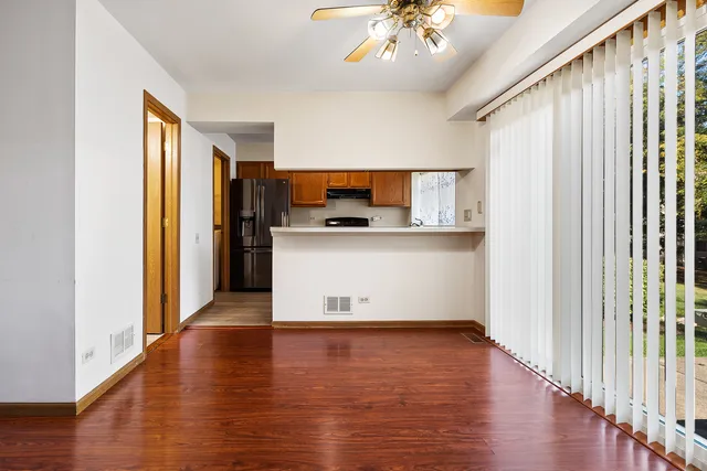 a view of a kitchen with a sink and wooden floor