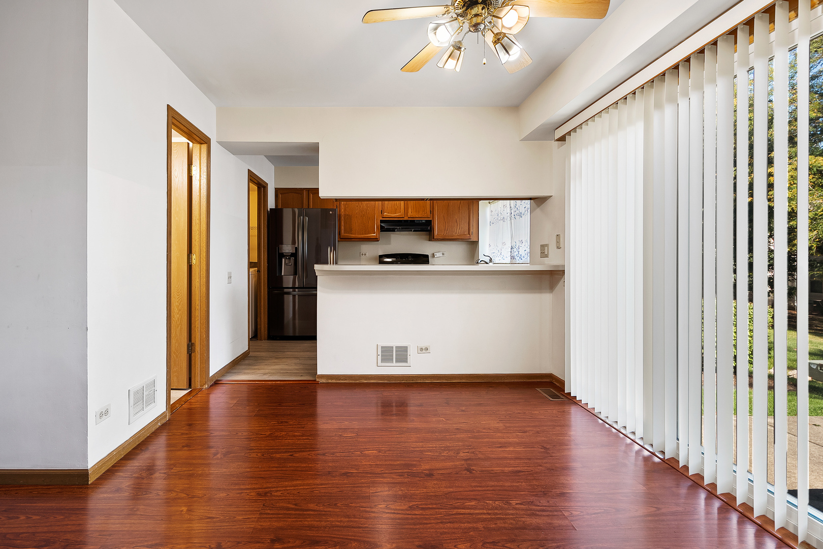 1404 West Sapphire Drive Hoffman Estates, IL 60192 - Photo 7 of 29 a view of a kitchen with a sink and wooden floor