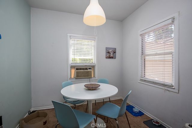 a dining room with a table and chairs
