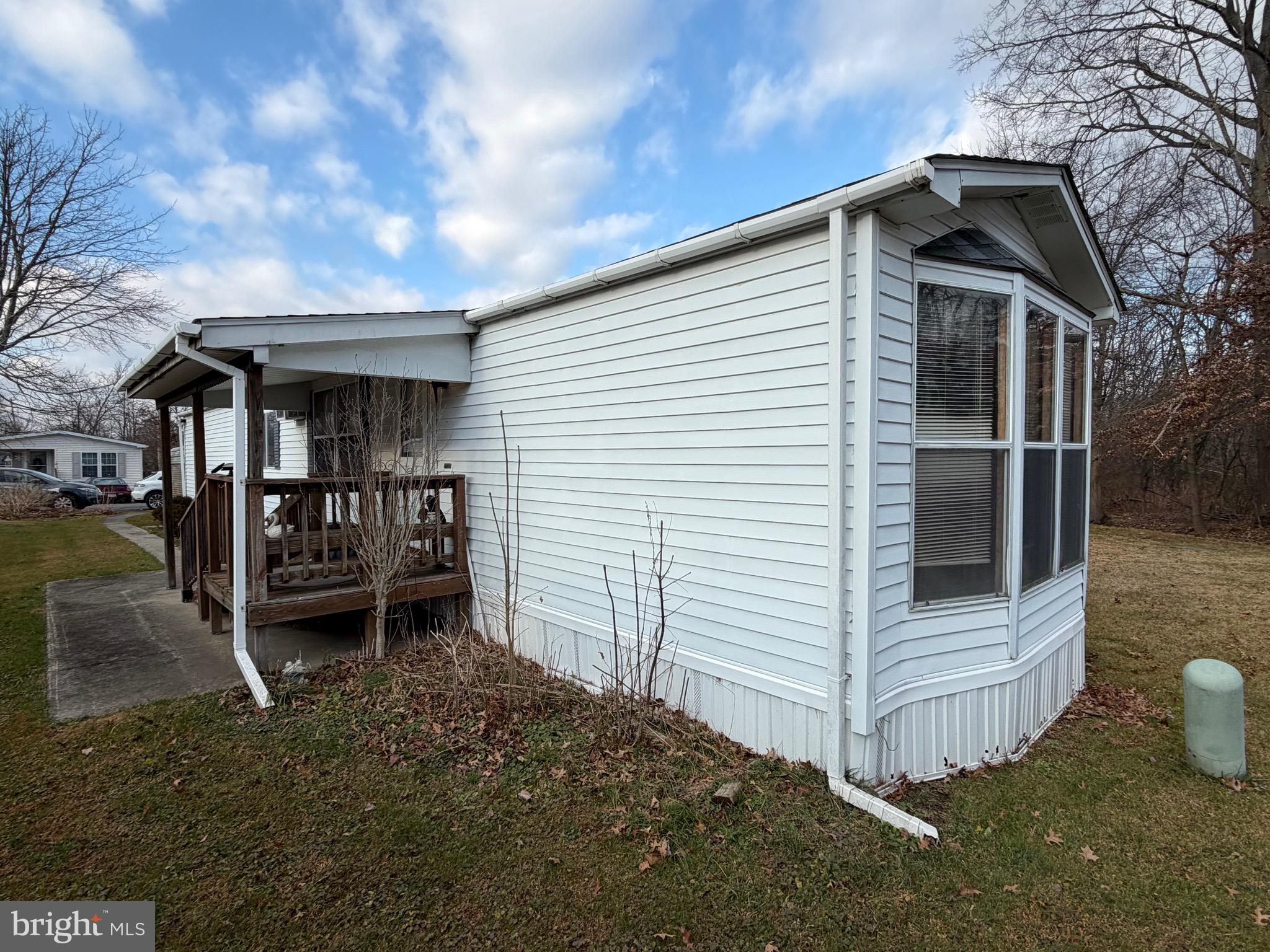 232 Yankee Road, Unit 156 Quakertown, PA 18951 - Photo 1 of 12 a front view of a house with a yard