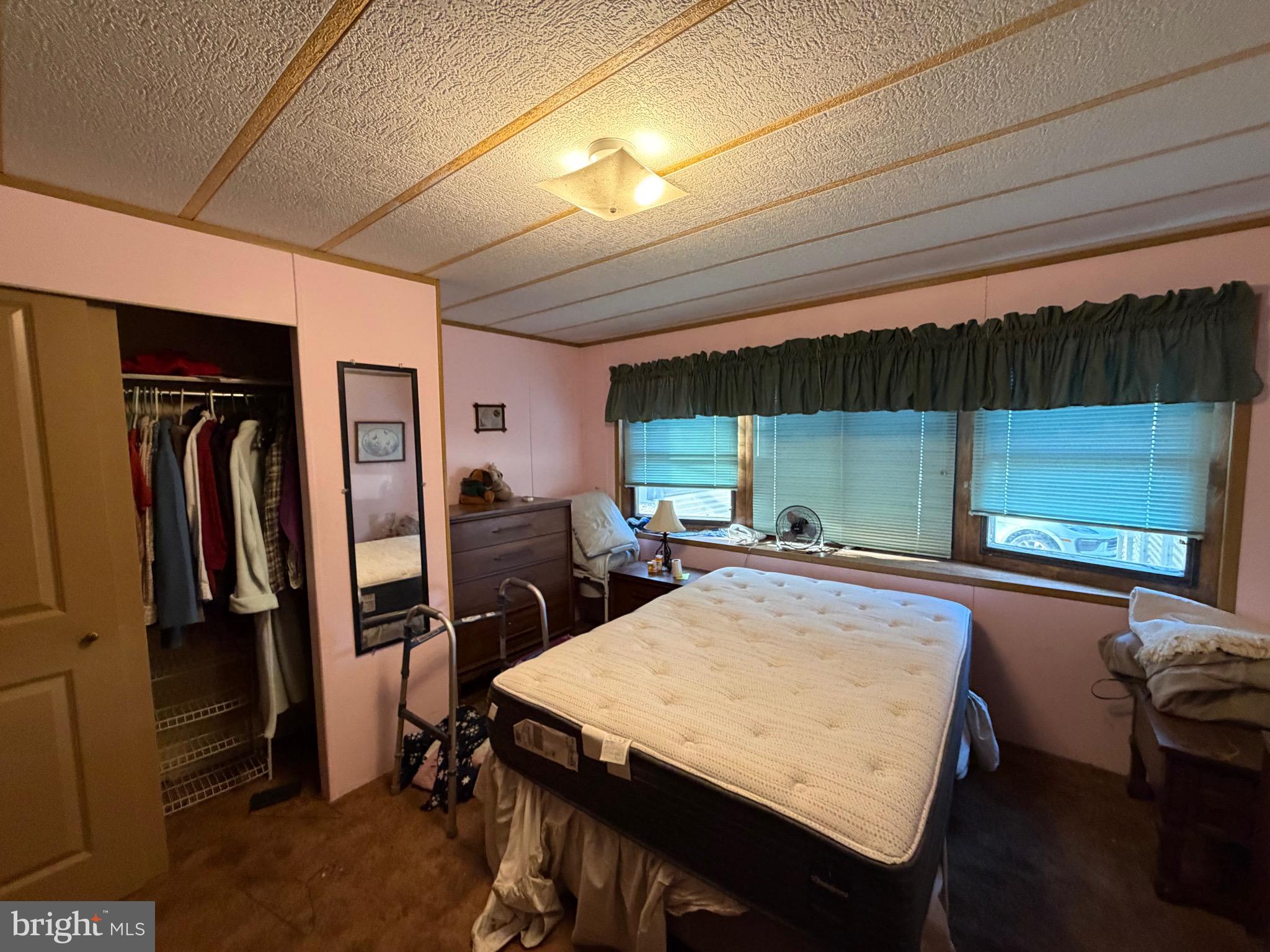 232 Yankee Road, Unit 156 Quakertown, PA 18951 - Photo 12 of 12 a kitchen with a table chairs a refrigerator and washer