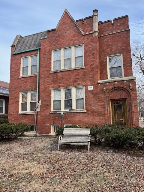 6832 West Medill Avenue, Unit 5 Chicago, IL 60707 - Photo 1 of 16 a front view of a house with a garden