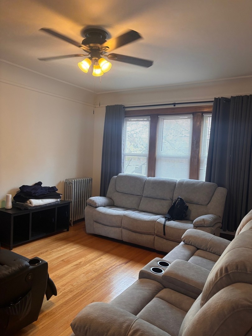 6832 West Medill Avenue, Unit 5 Chicago, IL 60707 - Photo 13 of 16 a living room with furniture and a window