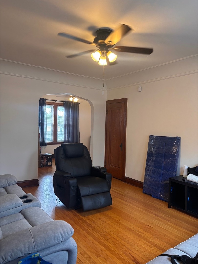 6832 West Medill Avenue, Unit 5 Chicago, IL 60707 - Photo 14 of 16 a living room with furniture and a mirror