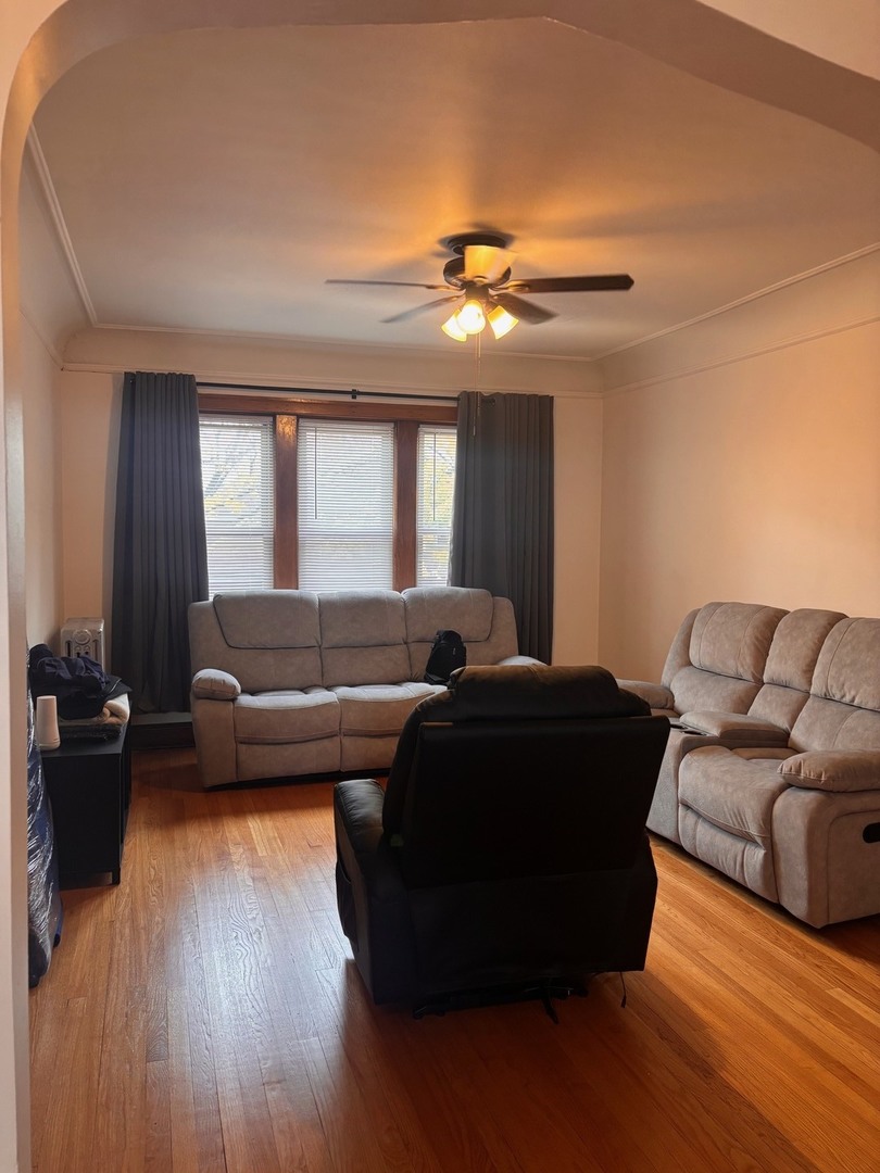 6832 West Medill Avenue, Unit 5 Chicago, IL 60707 - Photo 15 of 16 a living room with furniture and a wooden floor