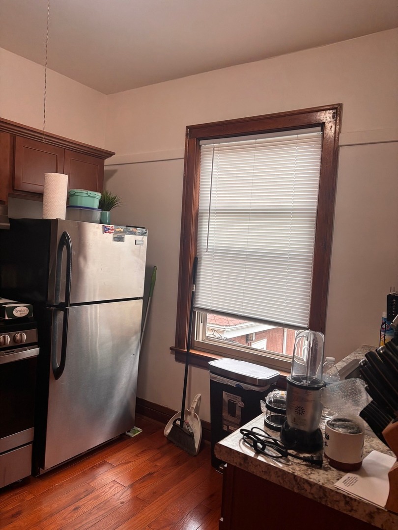 6832 West Medill Avenue, Unit 5 Chicago, IL 60707 - Photo 6 of 16 a kitchen with a stove and a refrigerator