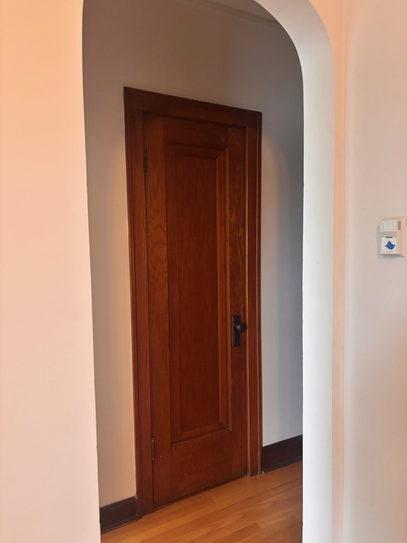 6832 West Medill Avenue, Unit 5 Chicago, IL 60707 - Photo 7 of 16 a view of front door with wooden floor
