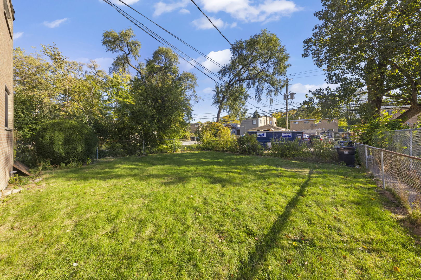 1311 Mcdaniel Avenue, Unit C Evanston, IL 60201 - Photo 22 of 40 a view of a swimming pool with a house in the background