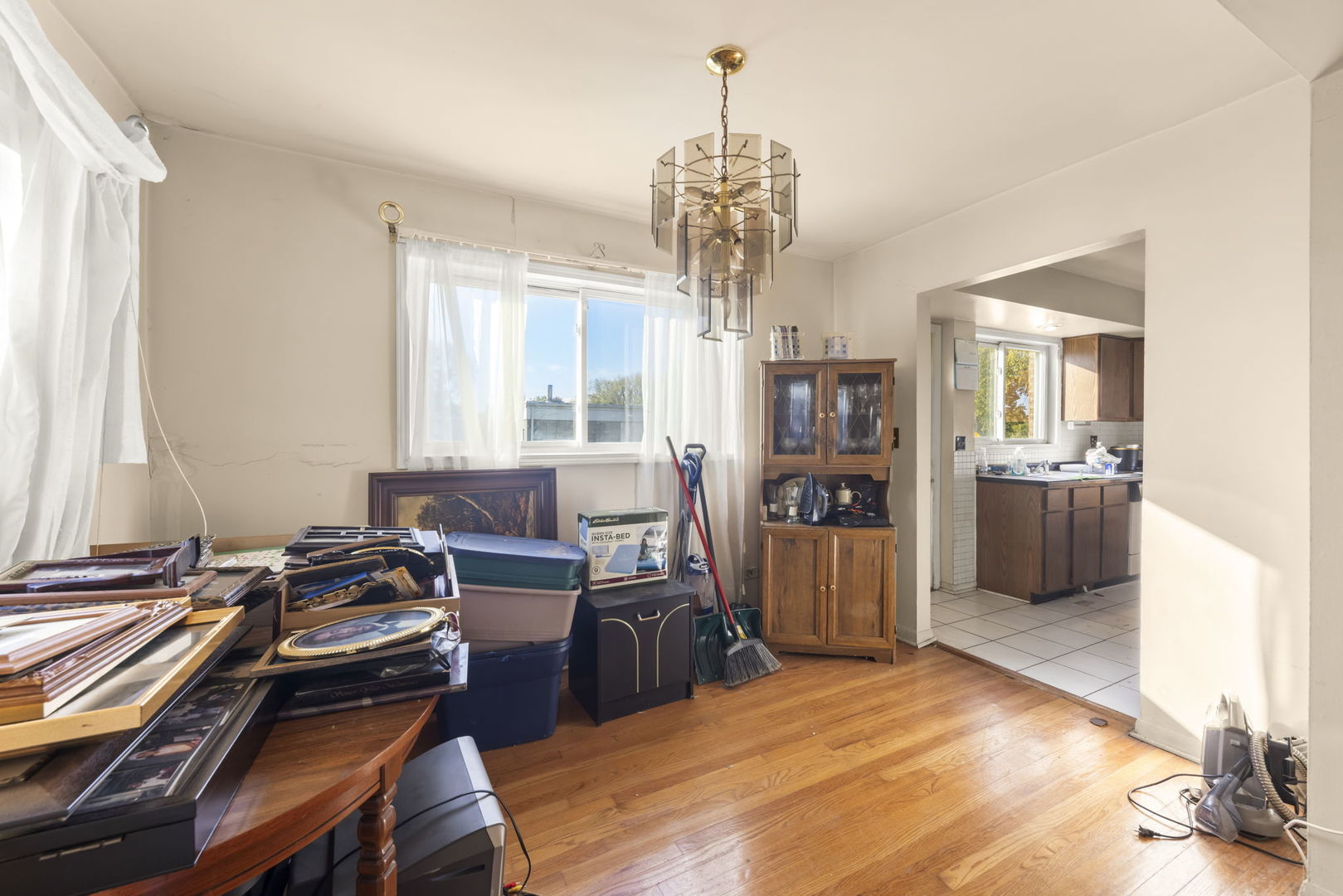 1311 Mcdaniel Avenue, Unit C Evanston, IL 60201 - Photo 7 of 40 a bedroom with furniture and a chandelier